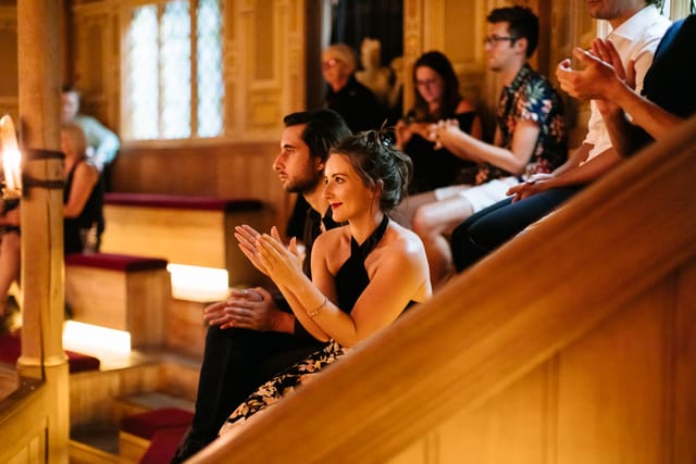 "Engaged audience at Sam Wanamaker Theatre, elegant venue for captivating events."