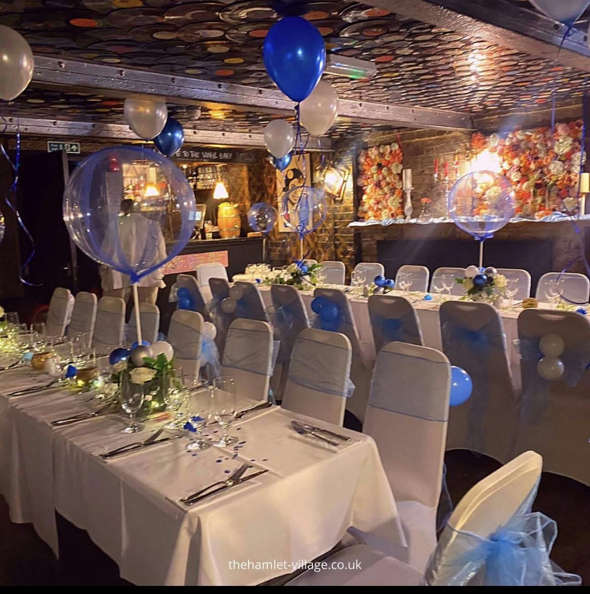 Elegant event space at The Hamlet Vinyl Bar with blue accents, perfect for weddings and celebrations.