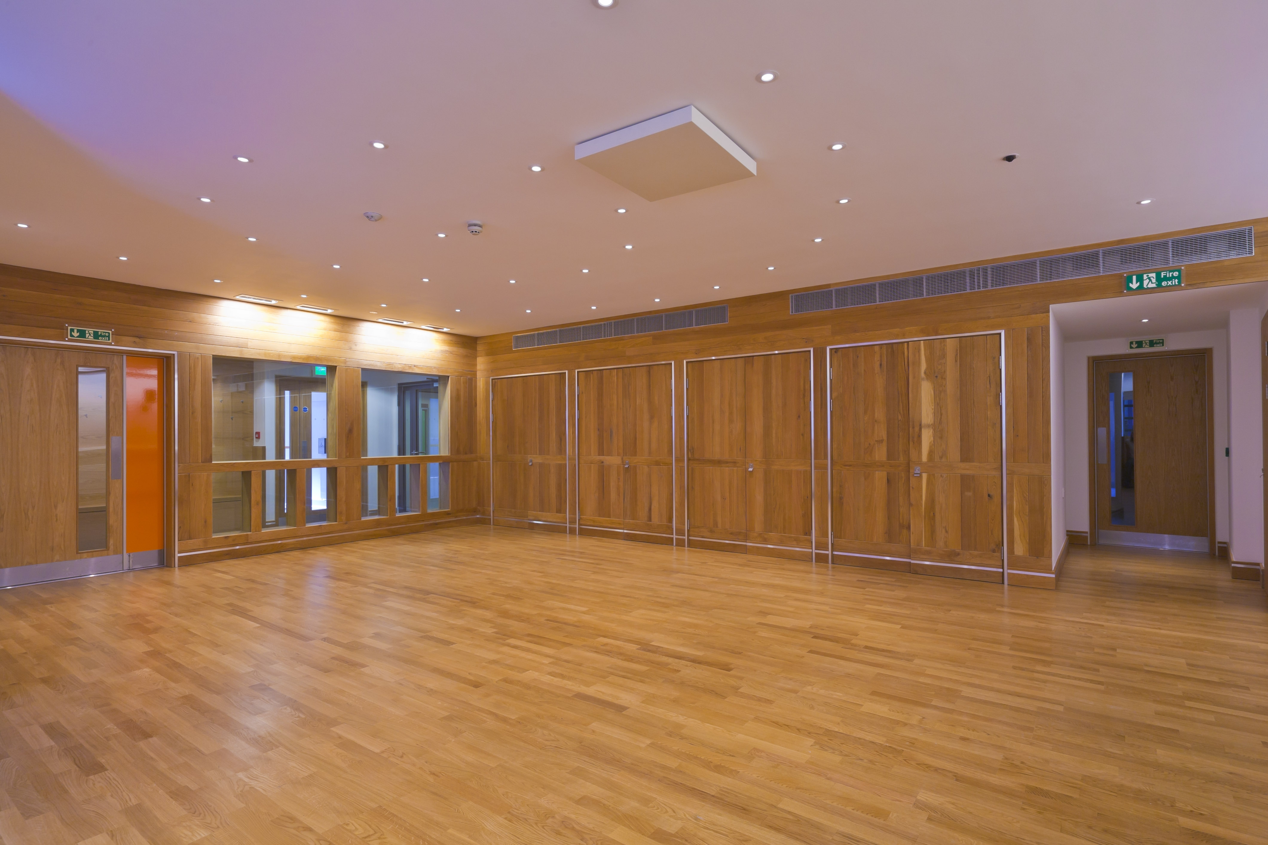 Education Studios at Shakespeare's Globe, warm wood accents, versatile event space.