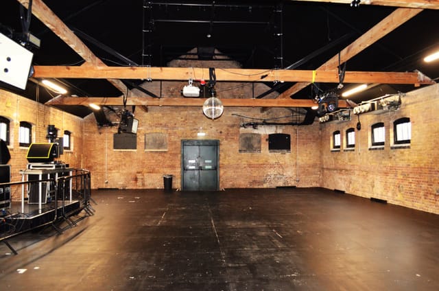 Versatile event space in Camden with exposed brick walls for corporate meetings and workshops.