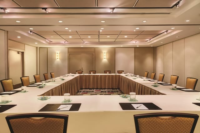 Meeting room at DoubleTree by Hilton Toronto with U-shaped seating for corporate events.