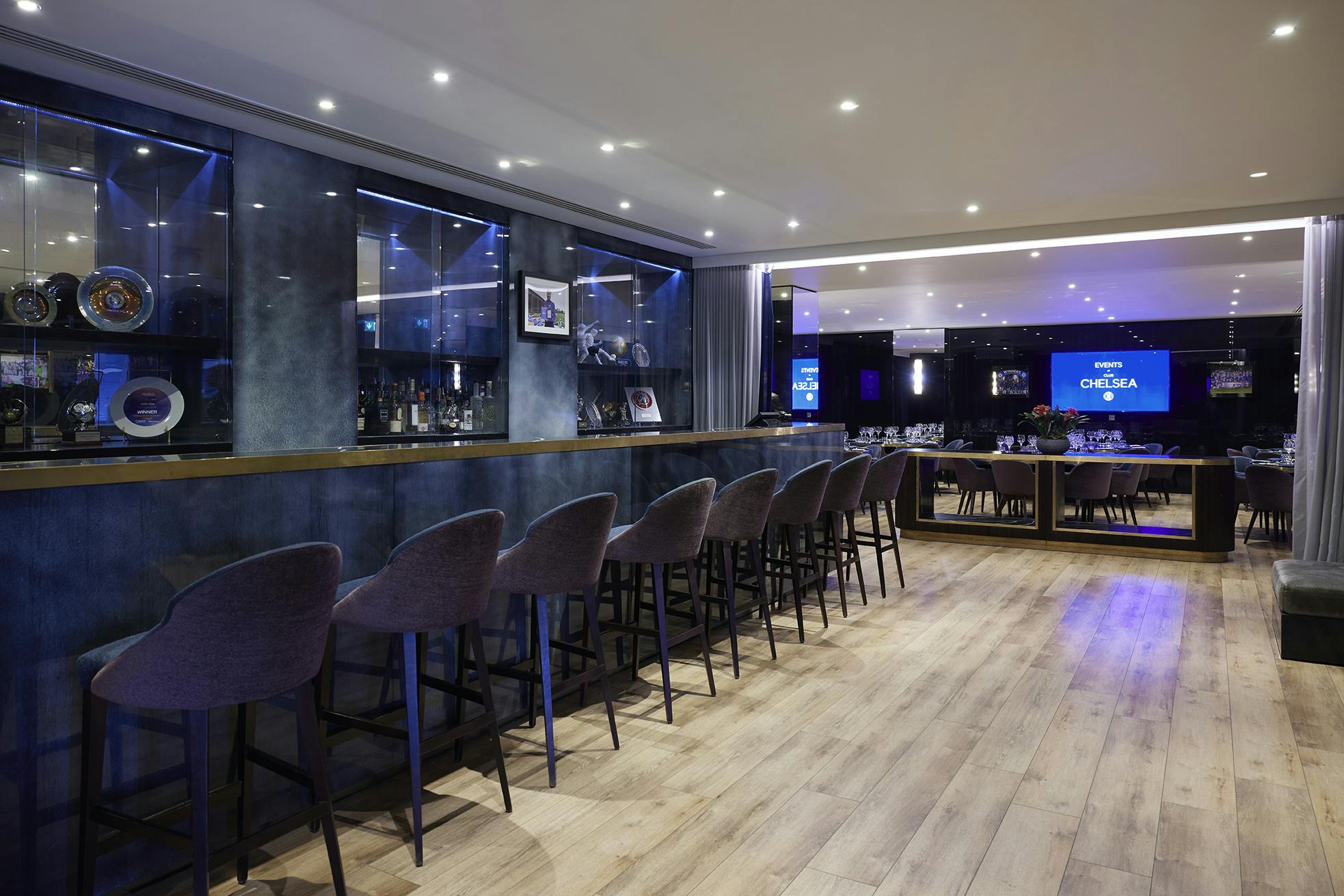Directors Lounge at Chelsea FC: modern event space with stylish bar for networking events.