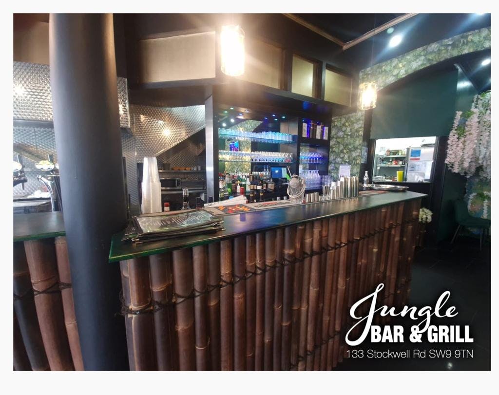 Vibrant bamboo bar setup at Jungle Bar & Grill, perfect for events and gatherings.