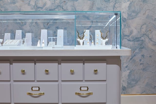 Sleek jewelry display case at The Alkemistry for upscale events and luxury gatherings.