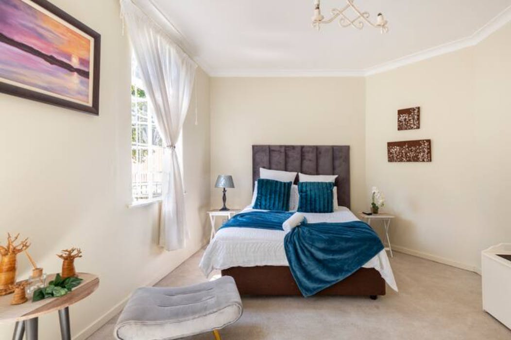 Cozy guest room at Royal Kynite, perfect for events and conferences.