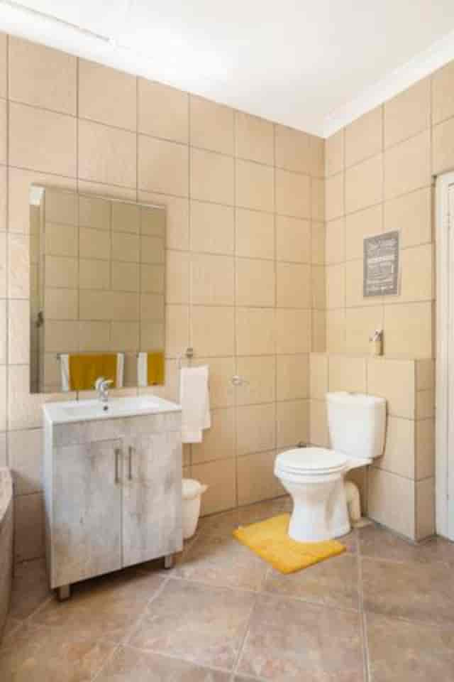 Clean restroom with modern fixtures for events and meetings in Royal Kynite.