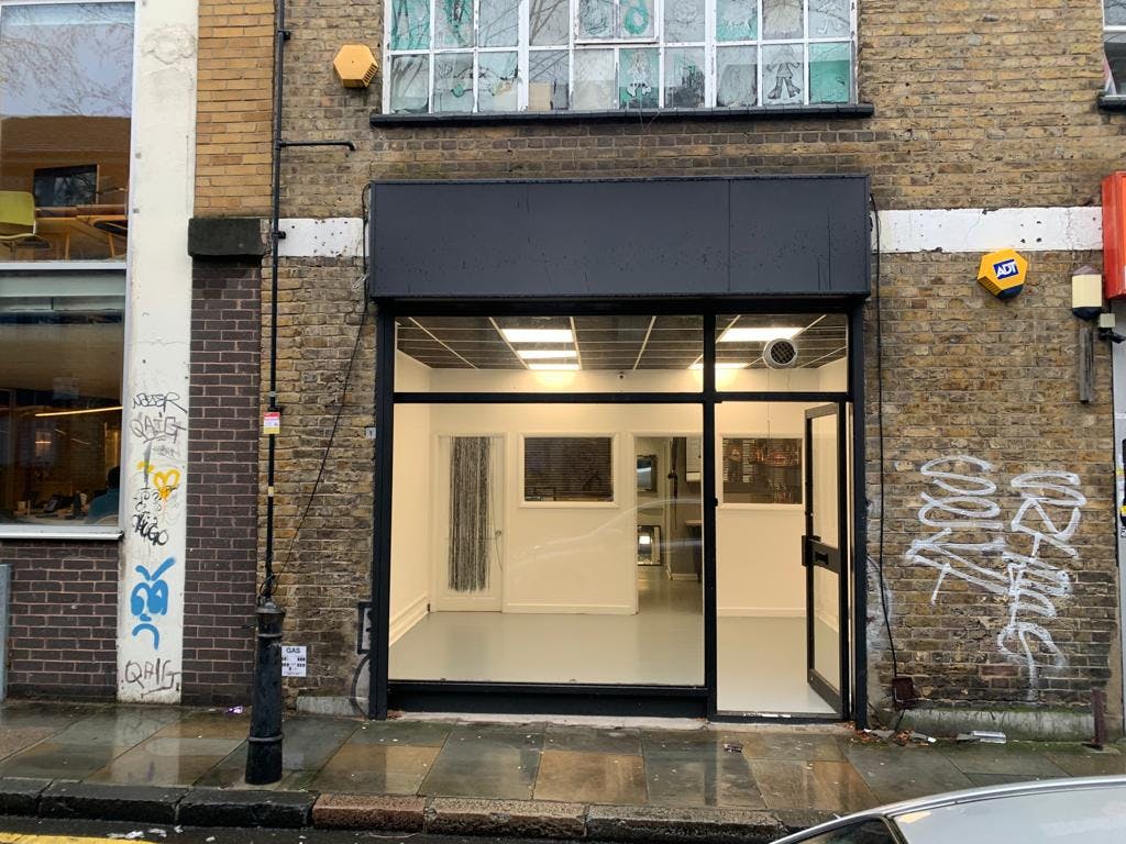 Modern art gallery with glass front, perfect for events and workshops.
