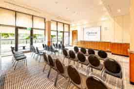 Newgate meeting space at Copthorne Hotel Newcastle with black chairs and natural light.