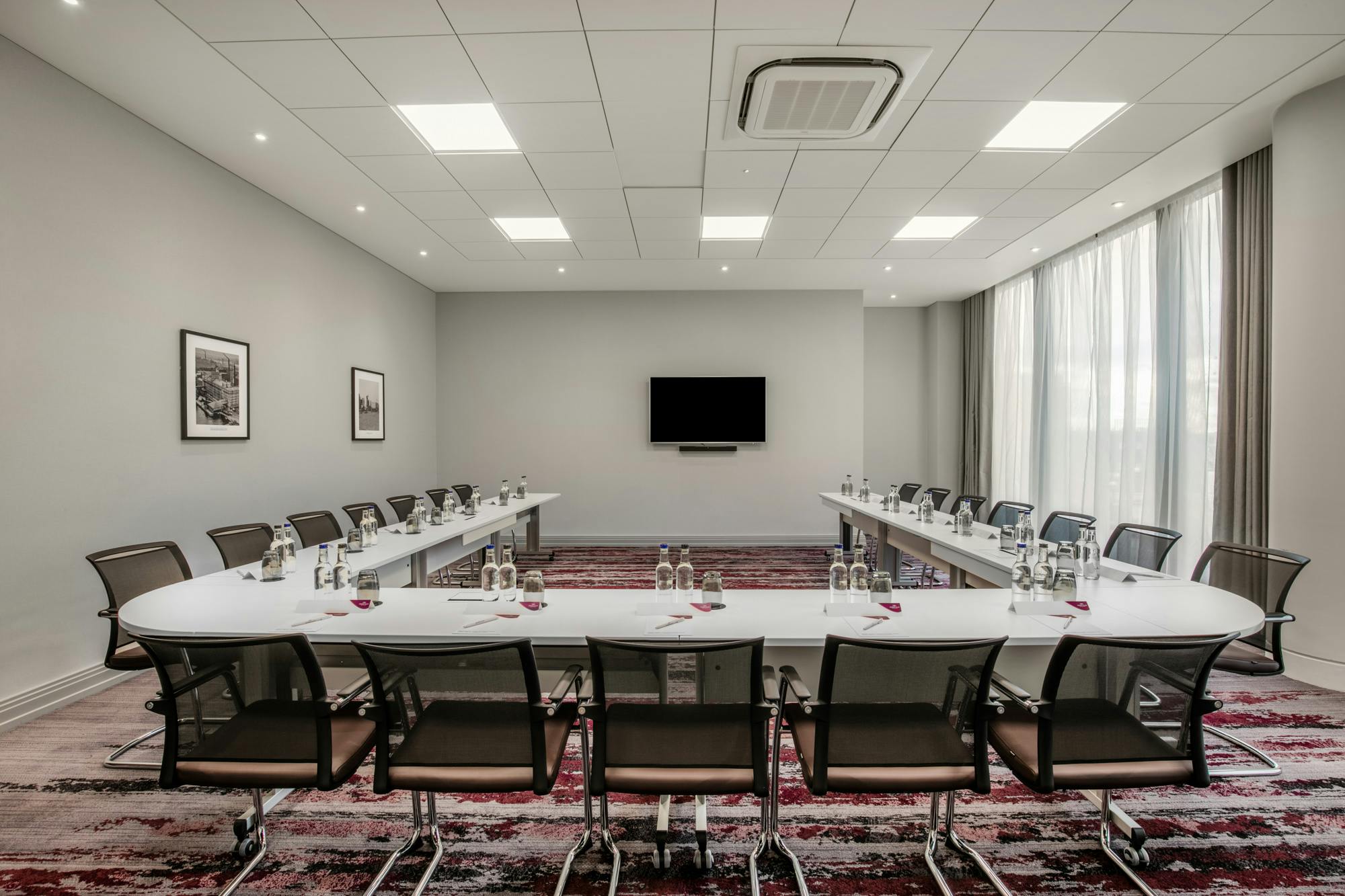 Victoria Suite at Crowne Plaza London Docklands, modern meeting room with oval table.