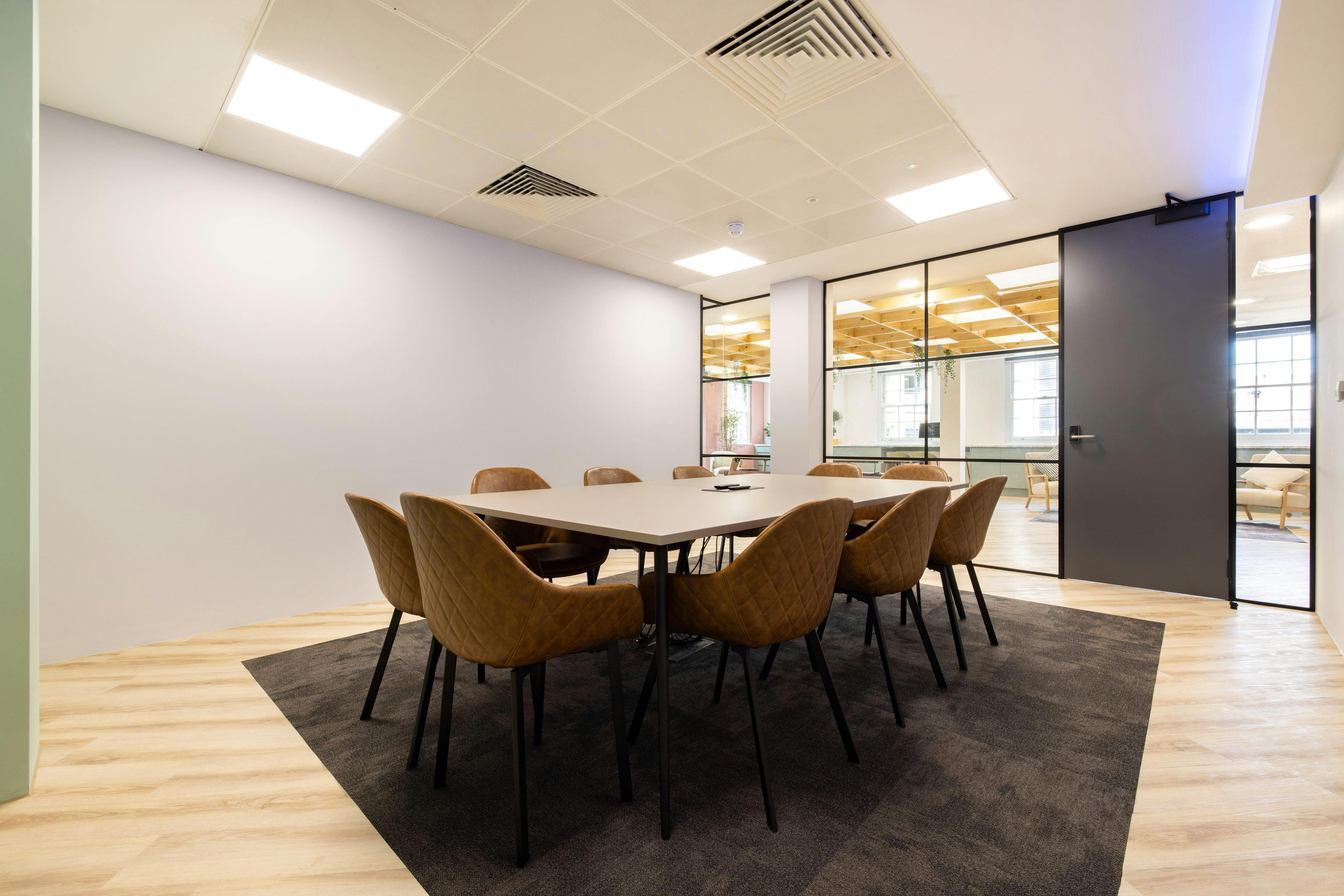 Modern meeting room with large table, ideal for collaborative sessions in Covent Garden.