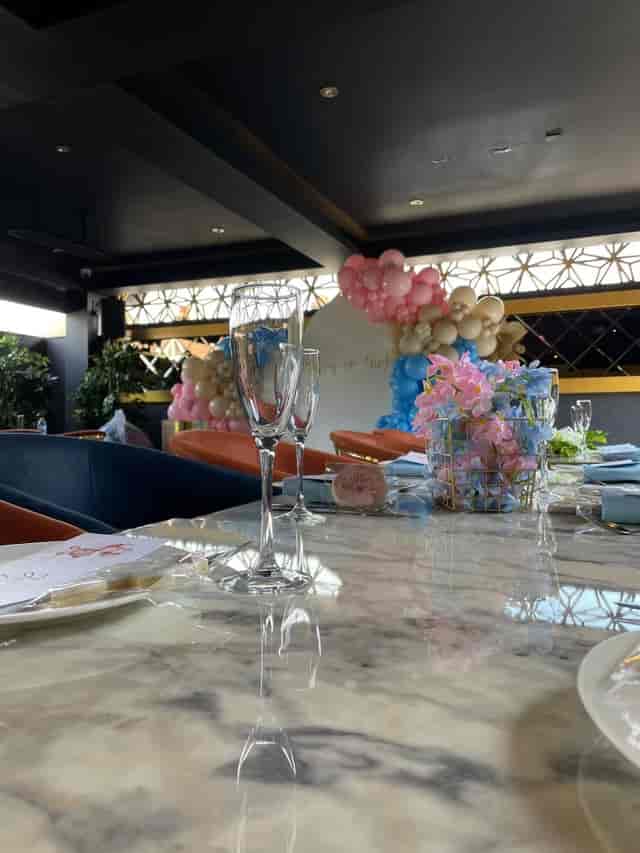 Elegant table setting with floral decor in Central Restaurant for baby showers and gatherings.