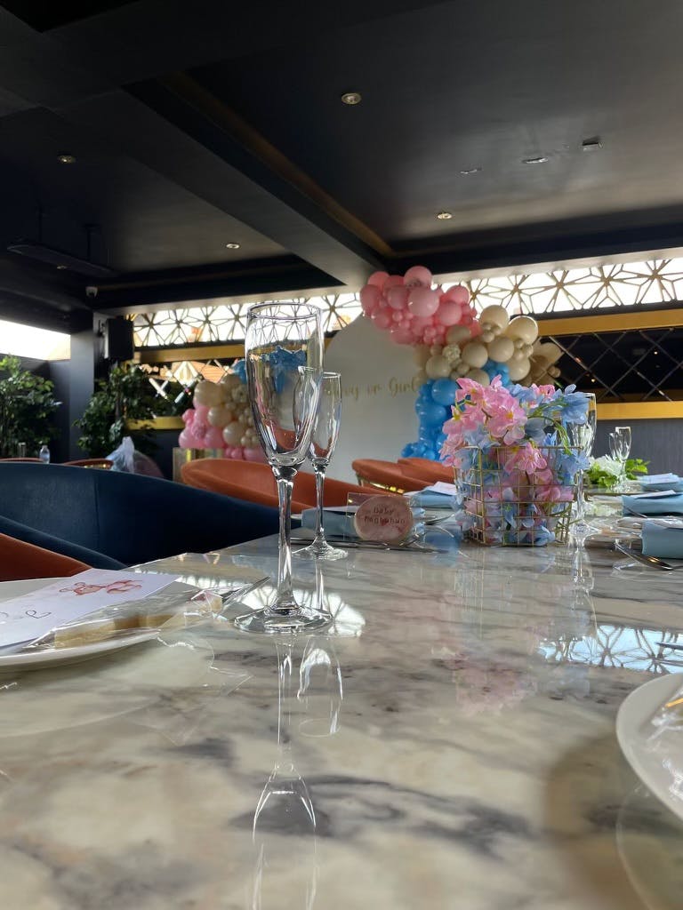 Elegant table setting with floral centerpieces for birthday parties and baby showers.