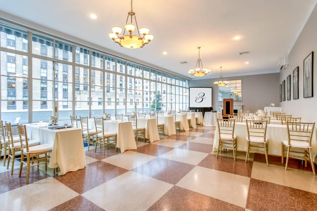 Elegant Solarium at 3 West Club, featuring large windows for corporate events.