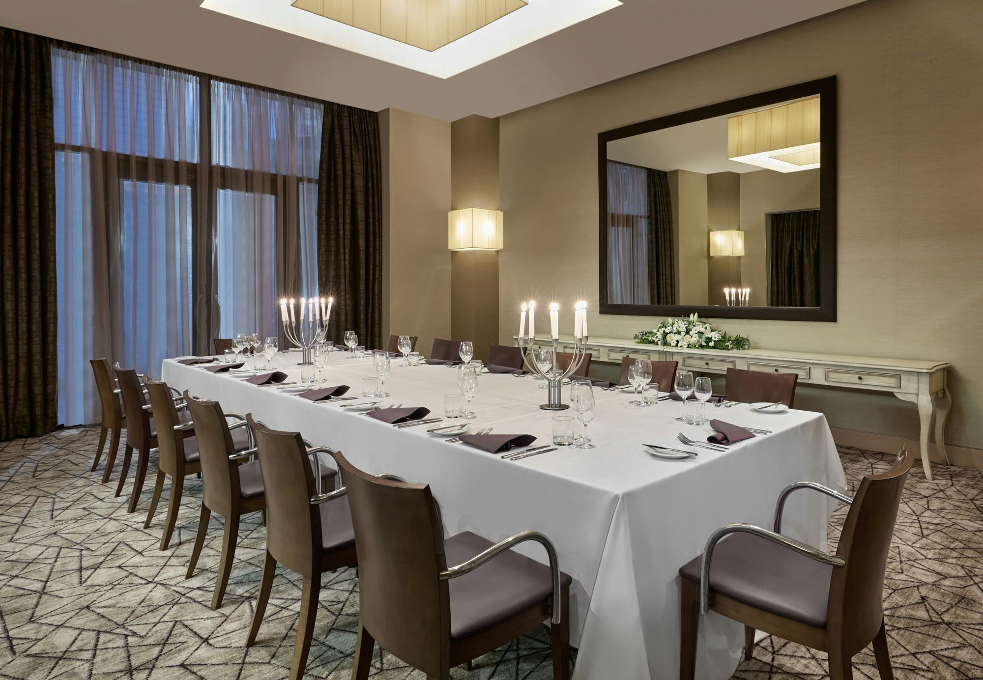 Private dining room at Crowne Plaza London Docklands, elegant setup for corporate events.