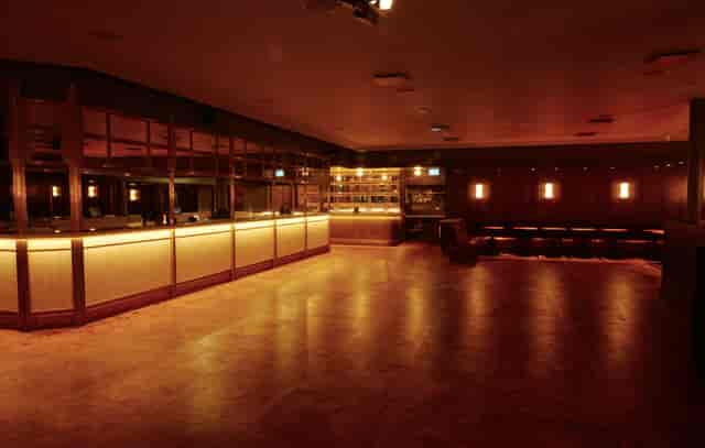 Versatile NEON194 Ballroom with sleek bar, ideal for cocktail receptions and networking events.
