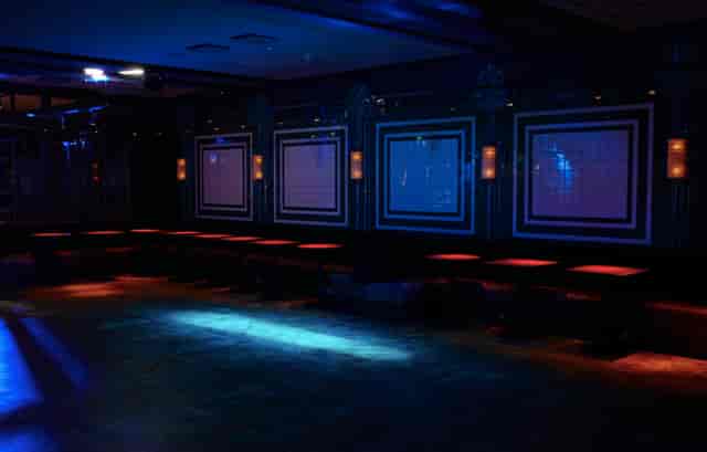 Stylish event space with ambient lighting, ideal for parties and networking events.