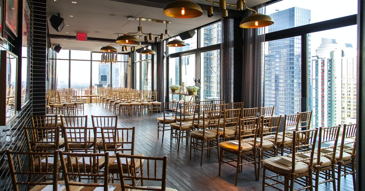 Indoor Main Lounge at The Skylark with gold-accented chairs for corporate events.