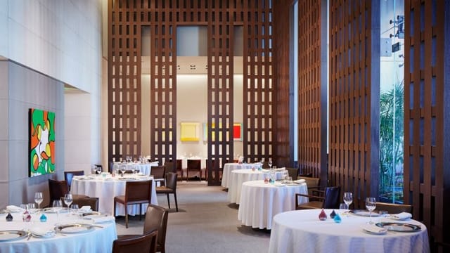 Elegant dining space at Restaurant Guy Savoy, ideal for upscale events and corporate dinners.