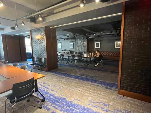 The Helm in Ivy Terrace: modern meeting space with exposed brick, ideal for workshops and corporate events.
