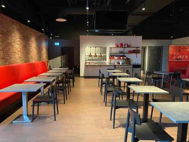 Gasworks Kitchen event space, red accent wall, Southampton networking venue, corporate meeting room.