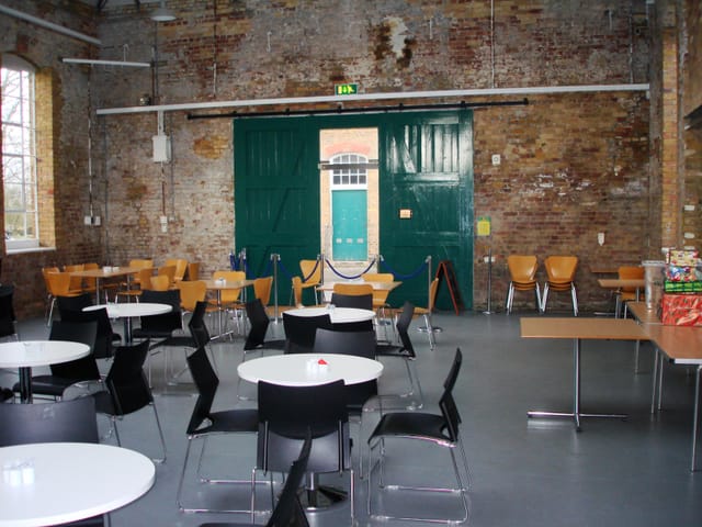 Gunpowder Café event space with exposed brick walls, perfect for workshops and gatherings.
