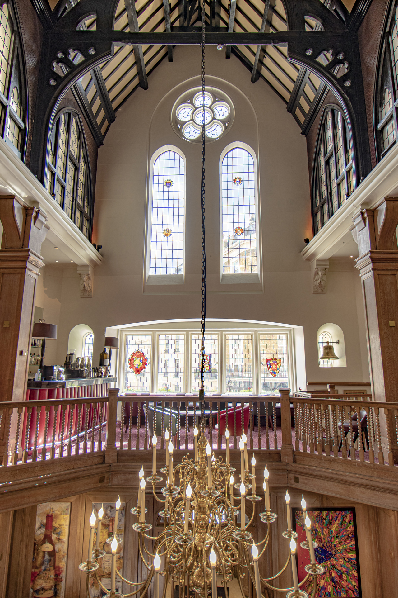 Elegant Main Dining Room at Mosimann's with stained glass, ideal for events and receptions. - Banner