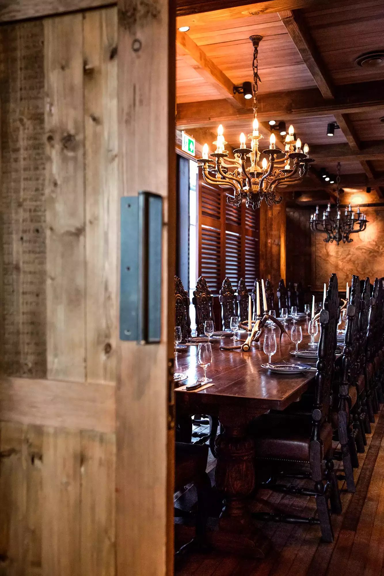 Elegant private dining room with wooden table, ideal for corporate events and intimate gatherings. - Banner