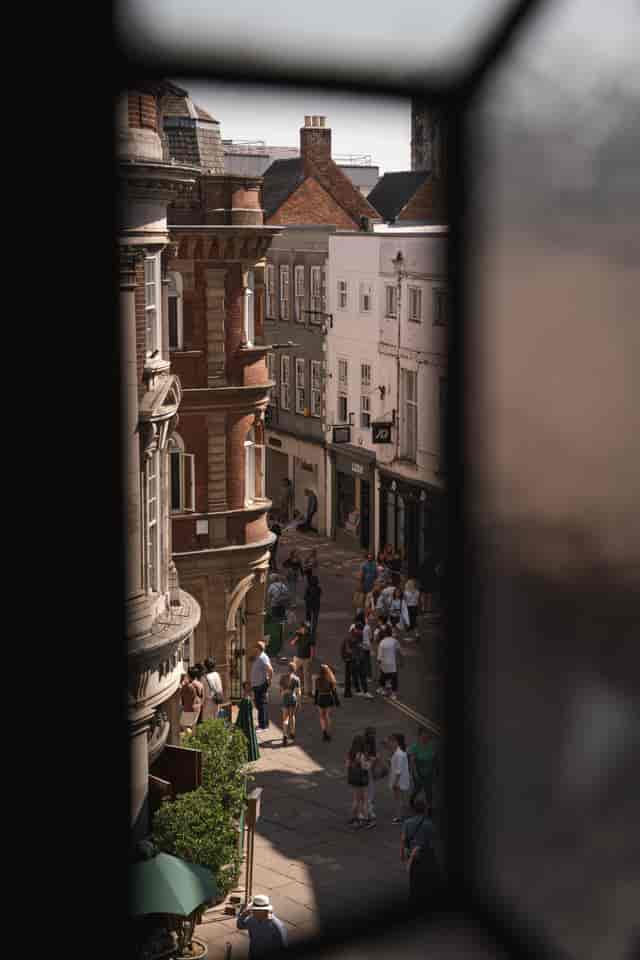 Vibrant street scene at Whiskey in Impossible York, ideal for outdoor networking events.