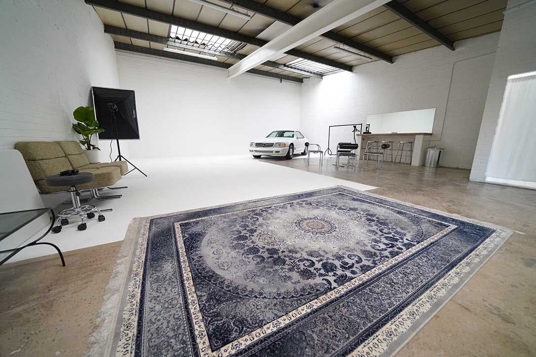 Versatile Ancoats Studio event space with classic car, ideal for meetings and launches.