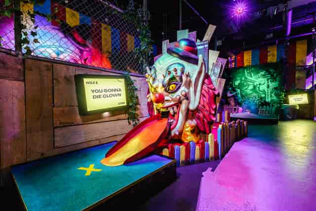 Bozo at Junkyard Golf Club, a colorful venue for themed events and team-building activities.