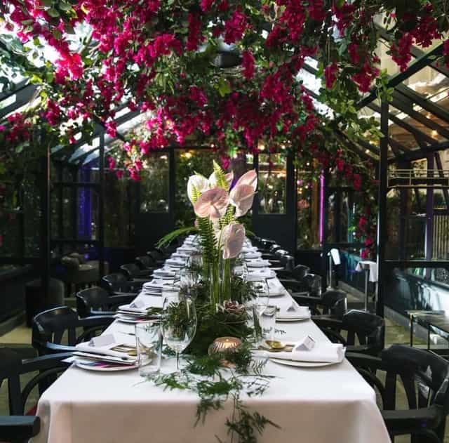 Elegant Wisteria dining space with fine tableware for upscale events and intimate gatherings.