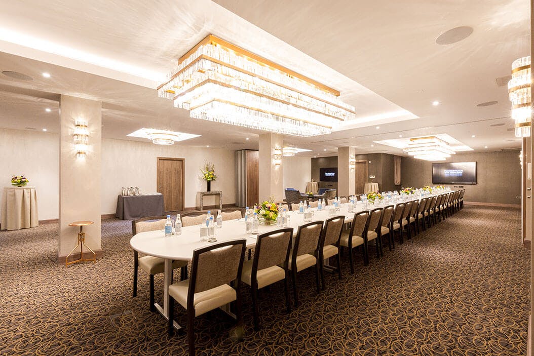 Sophisticated corporate meeting space with elegant chandeliers for events and workshops.