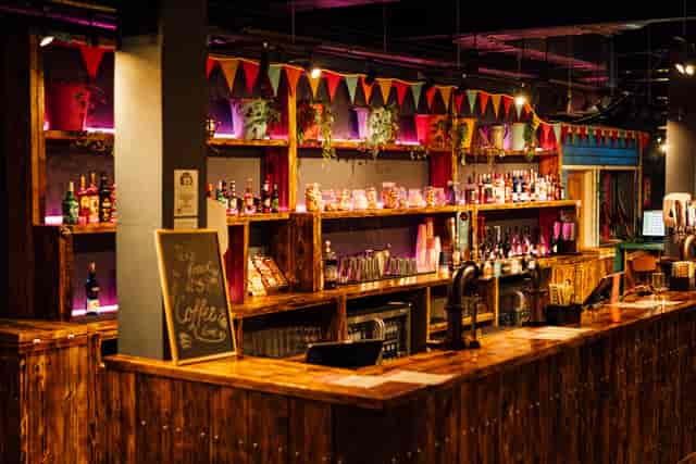 Vibrant bar setup with rustic decor for events at Caddies Crawley, ideal for gatherings.