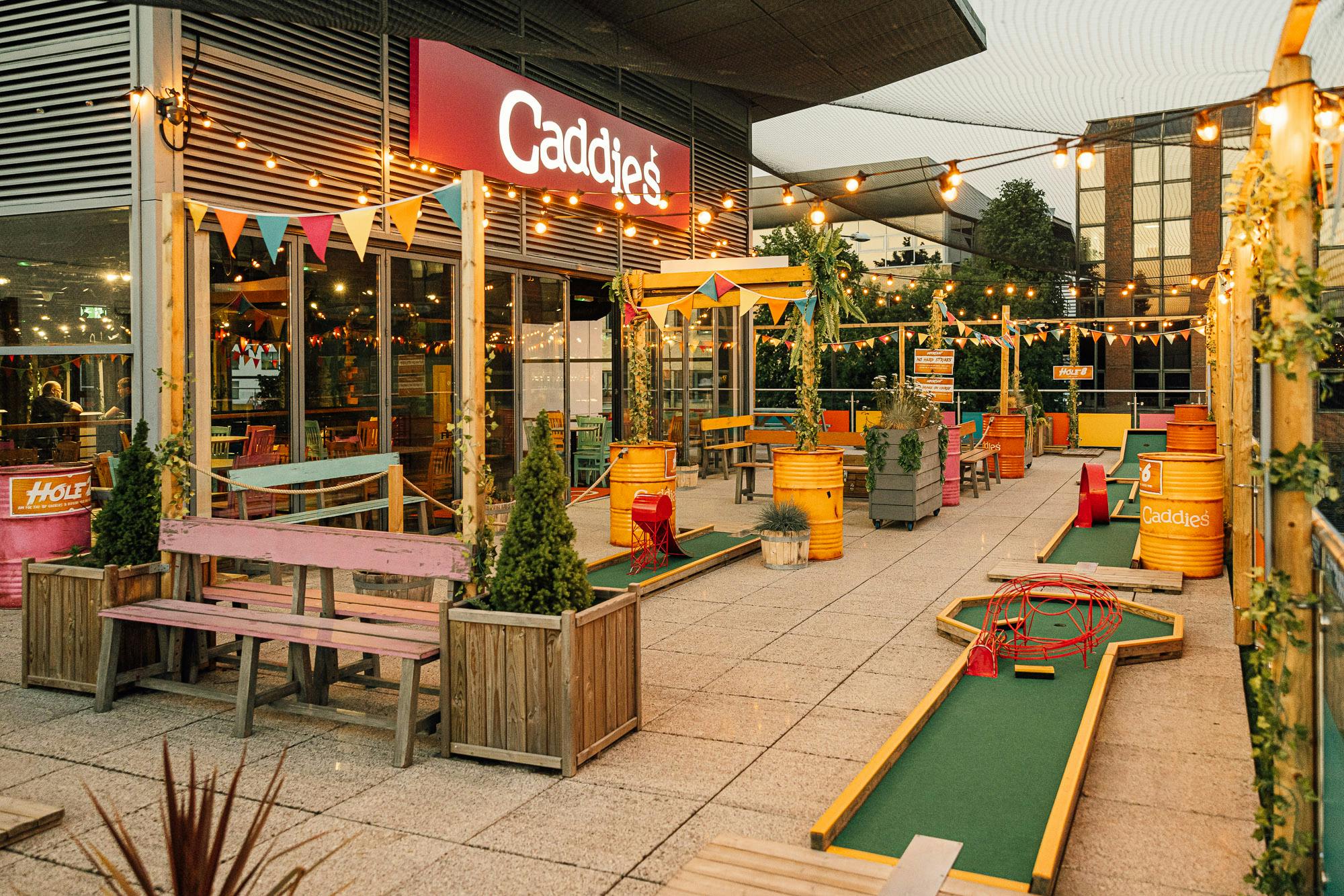 Vibrant outdoor event space with mini-golf for networking and team-building activities.