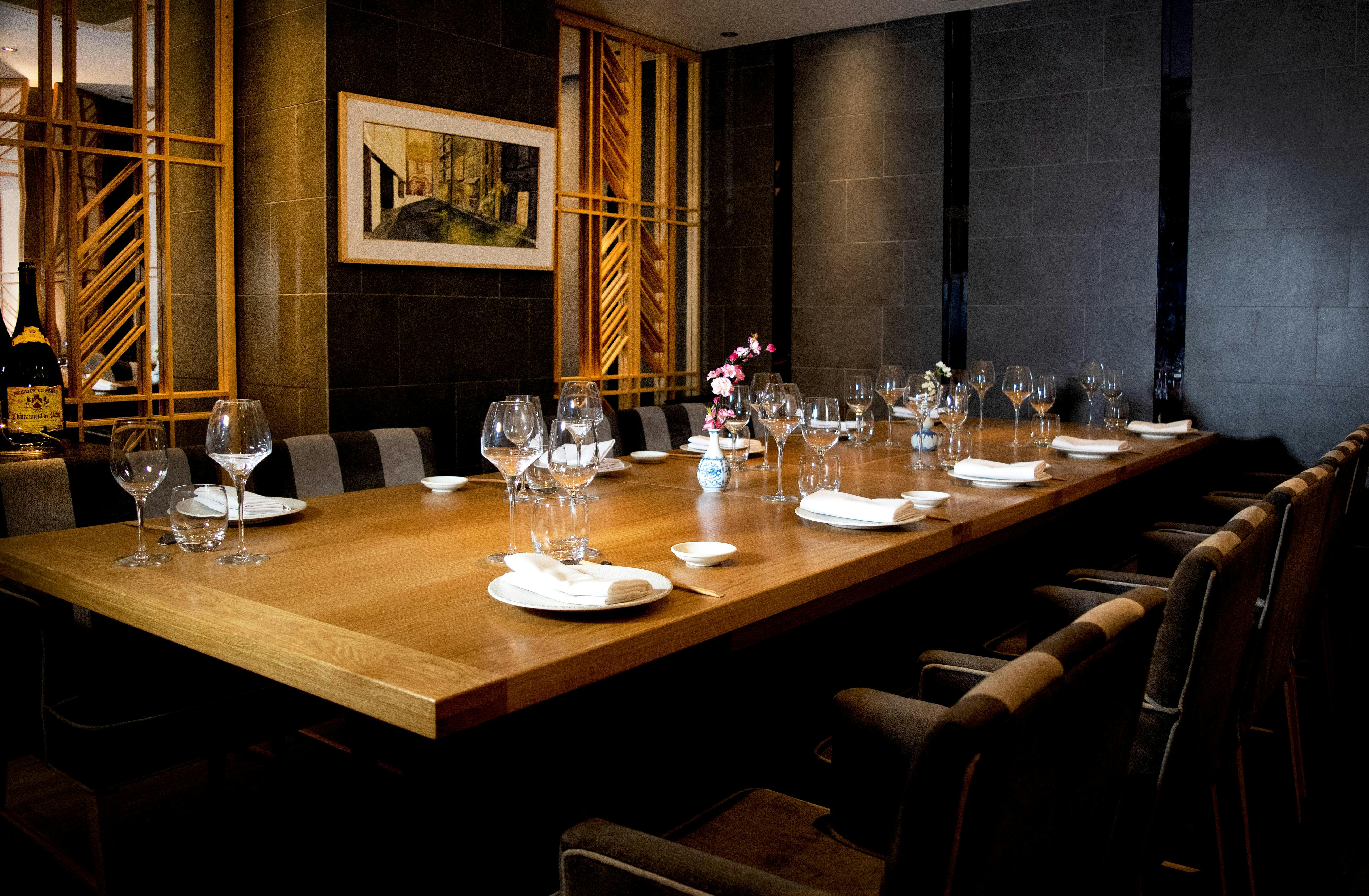 Large private dining room in Ginza St James's, elegant table setup for exclusive events.