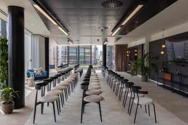 Modern event space with sleek seating for corporate meetings at x+why 100 Embankment.