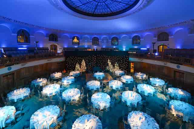 Festive holiday party at Church House Westminster featuring elegant blue-themed event decor.