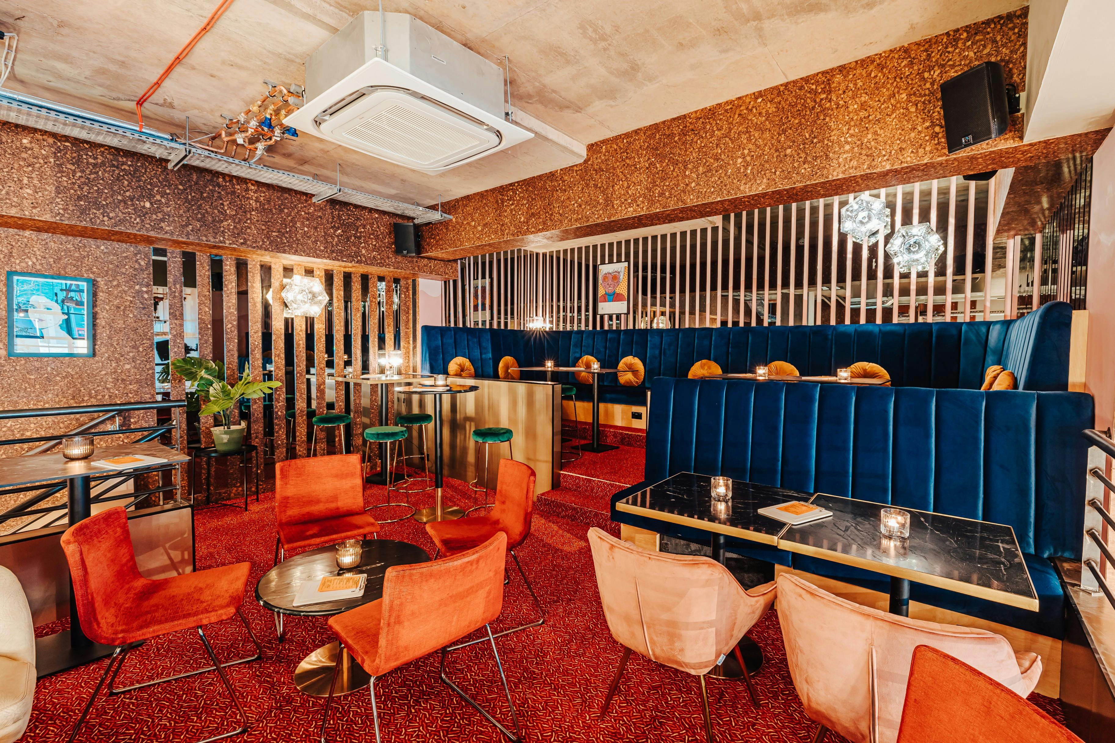 Stylish Mezzanine venue with plush seating for intimate gatherings and networking events.