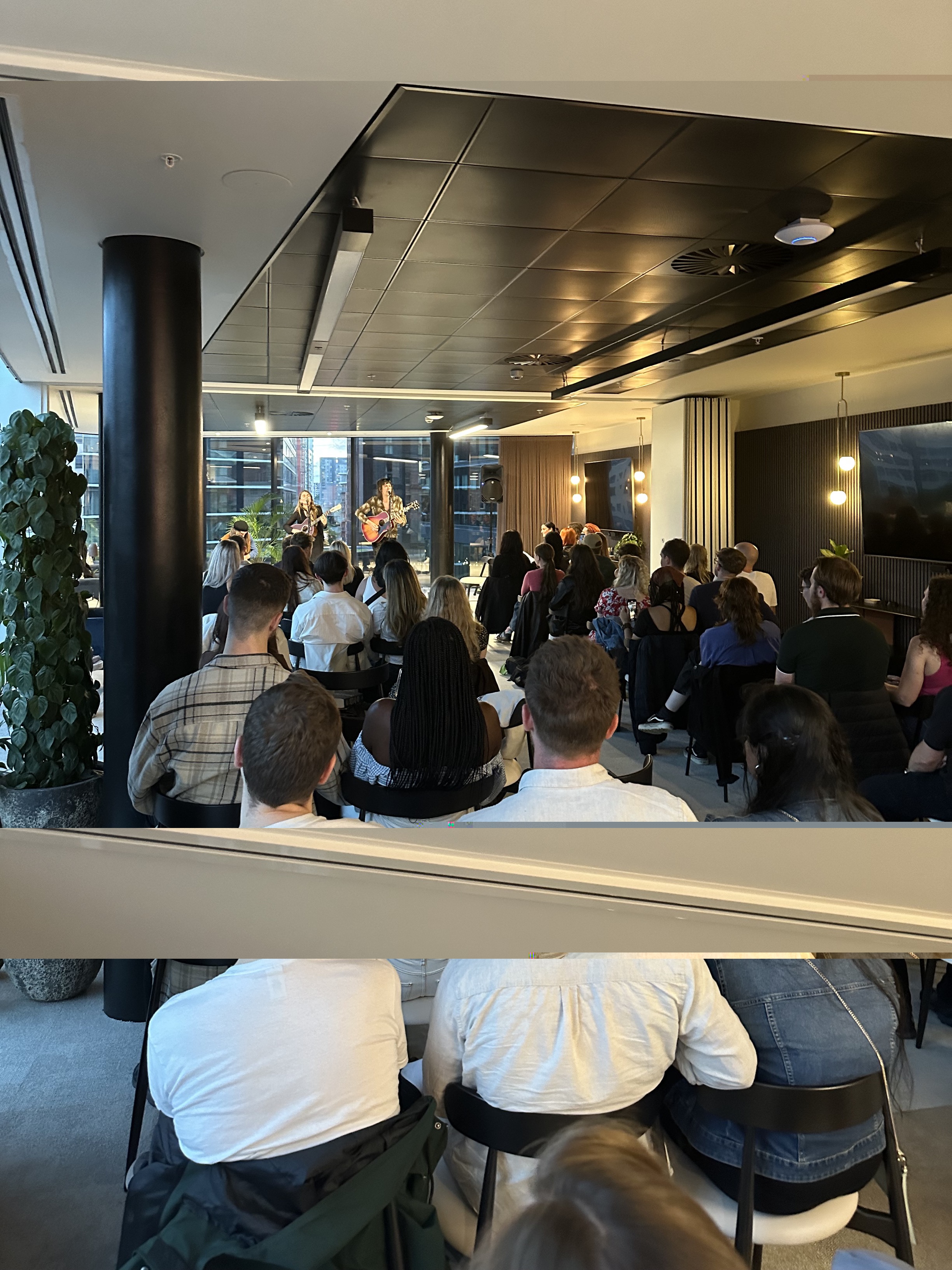 Engaged audience in modern event space at x+why 100 Embankment. Networking and interaction.