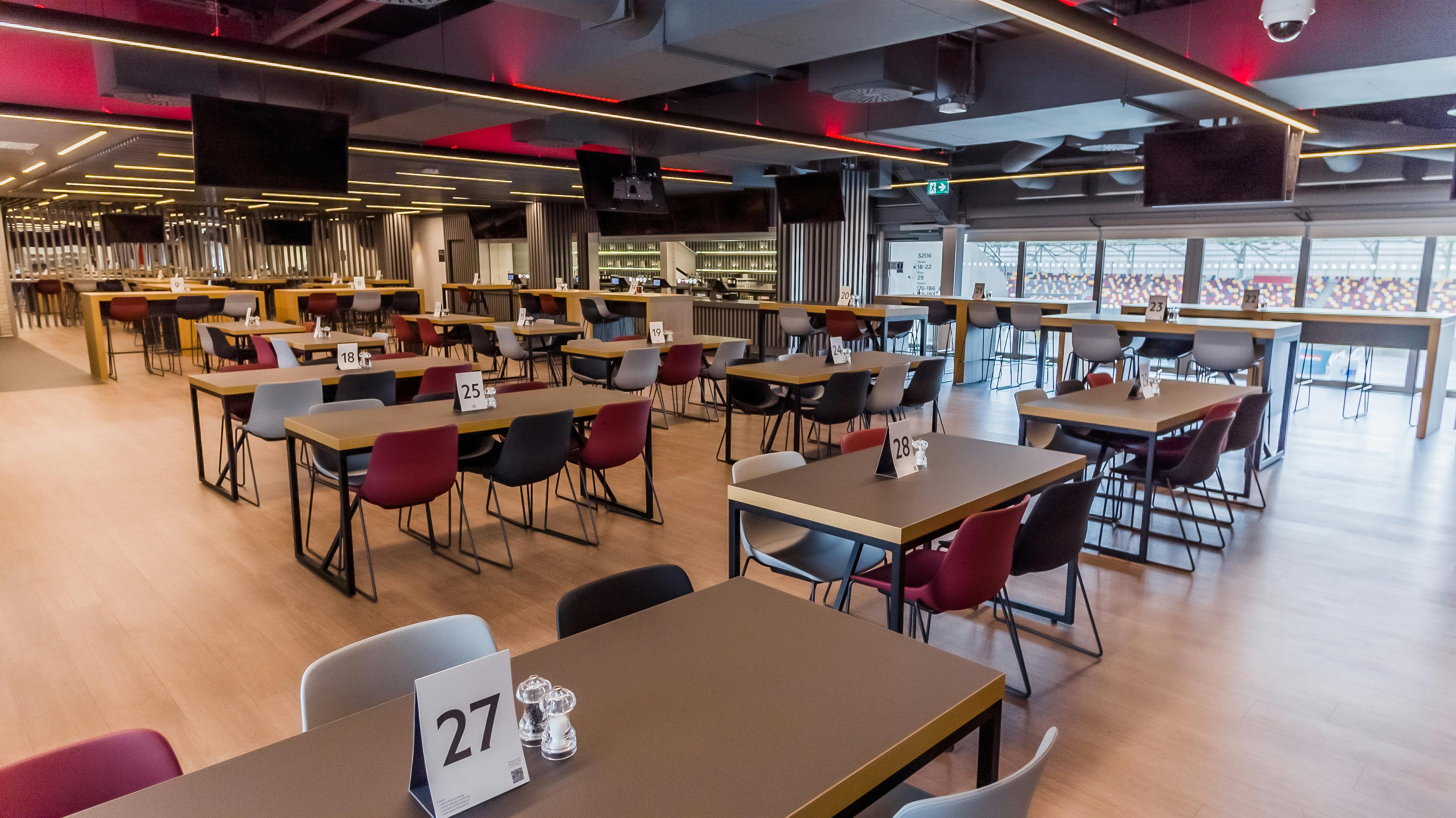 Modern event space at Brentford FC with flexible seating for networking and dining events.