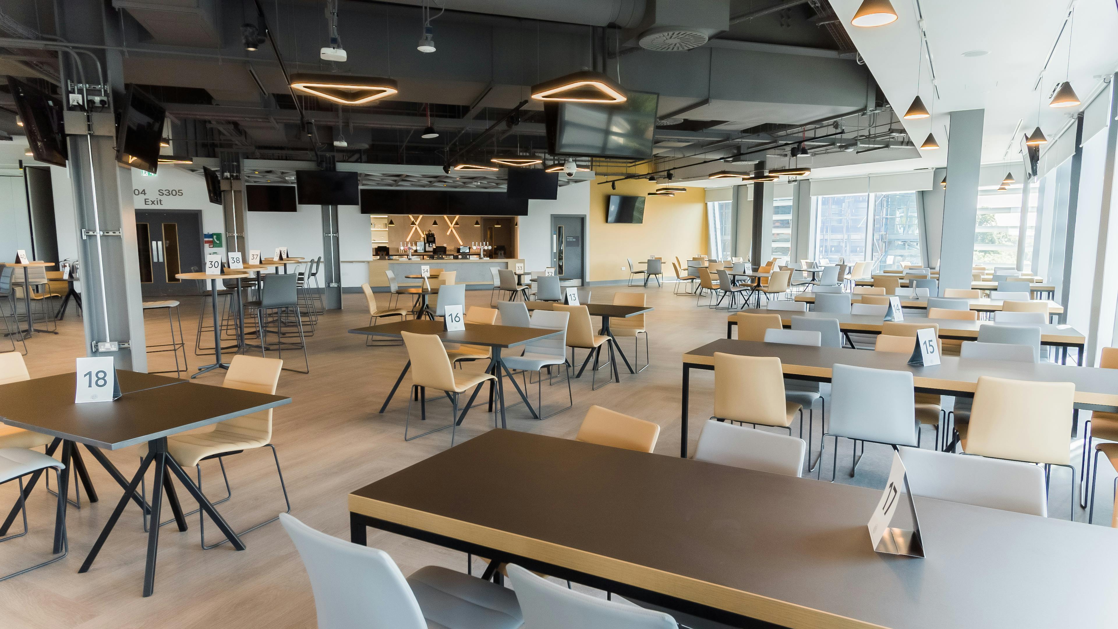 Modern event space at Brentford FC with flexible seating for conferences and gatherings.