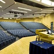 Spacious auditorium with tiered seating for conferences at 20 Bedford Way.