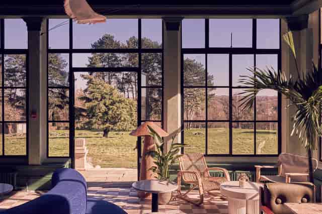 Stylish event space at Birch Selsdon with large windows, perfect for meetings and gatherings.