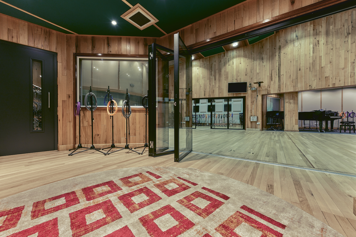 Spacious Angel Studios event space with wooden accents, ideal for workshops and meetings.