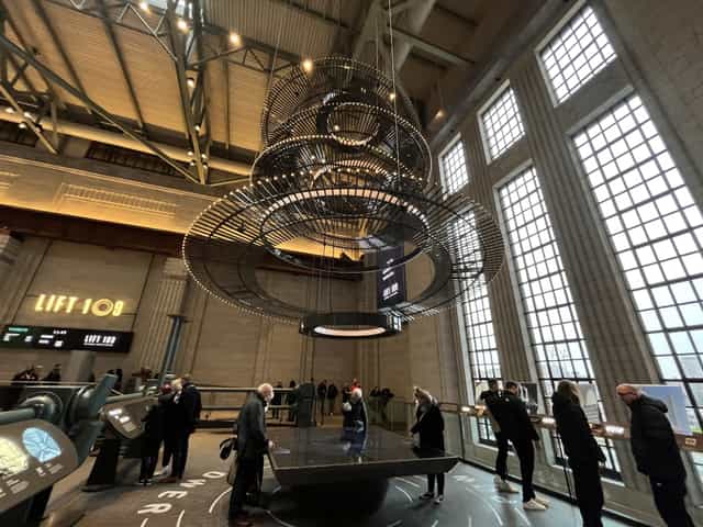 Modern event space at Battersea Power Station with chandelier, ideal for corporate events.