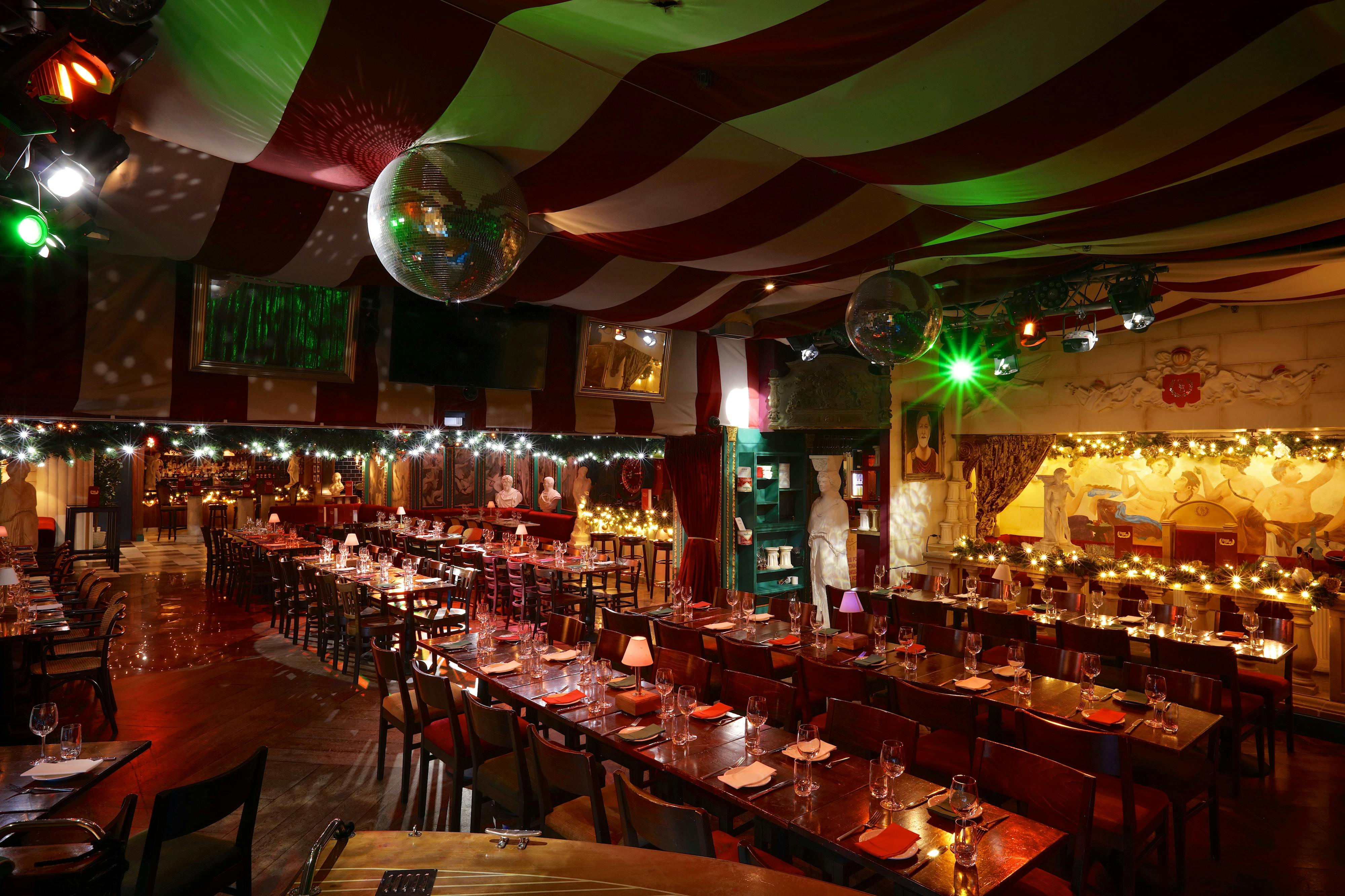 Vibrant Bunga Bunga venue with striped drapery, perfect for parties and celebrations.