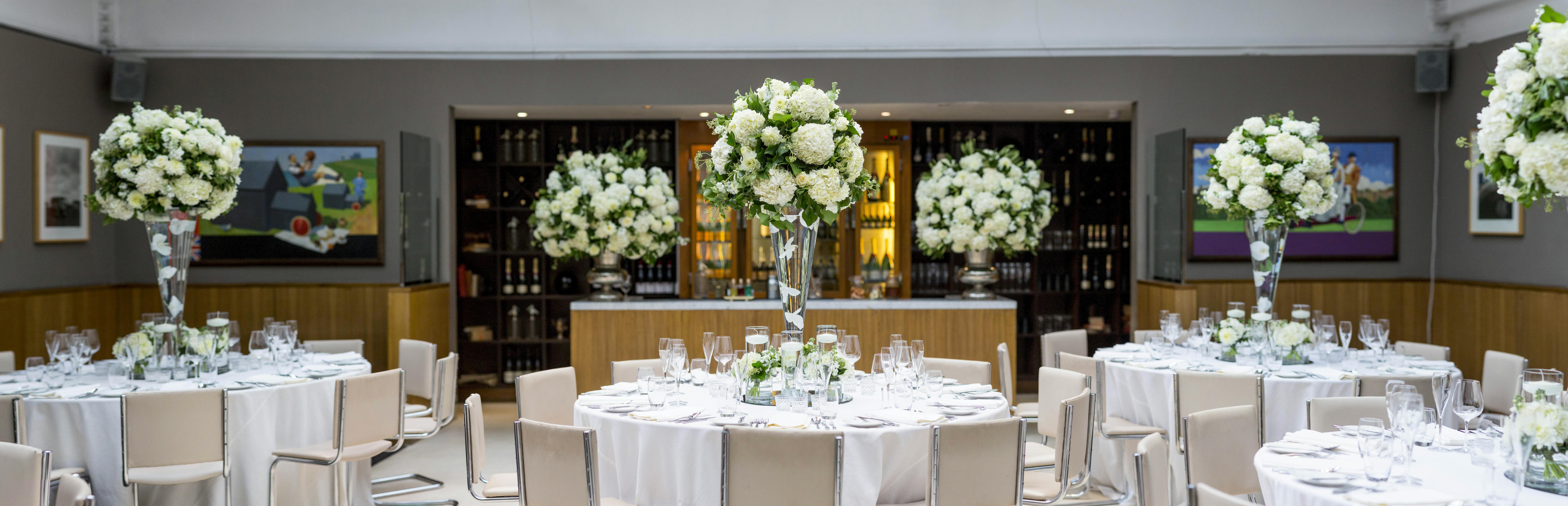 Elegant wedding dining area with floral arrangements at Bluebird Chelsea venue.