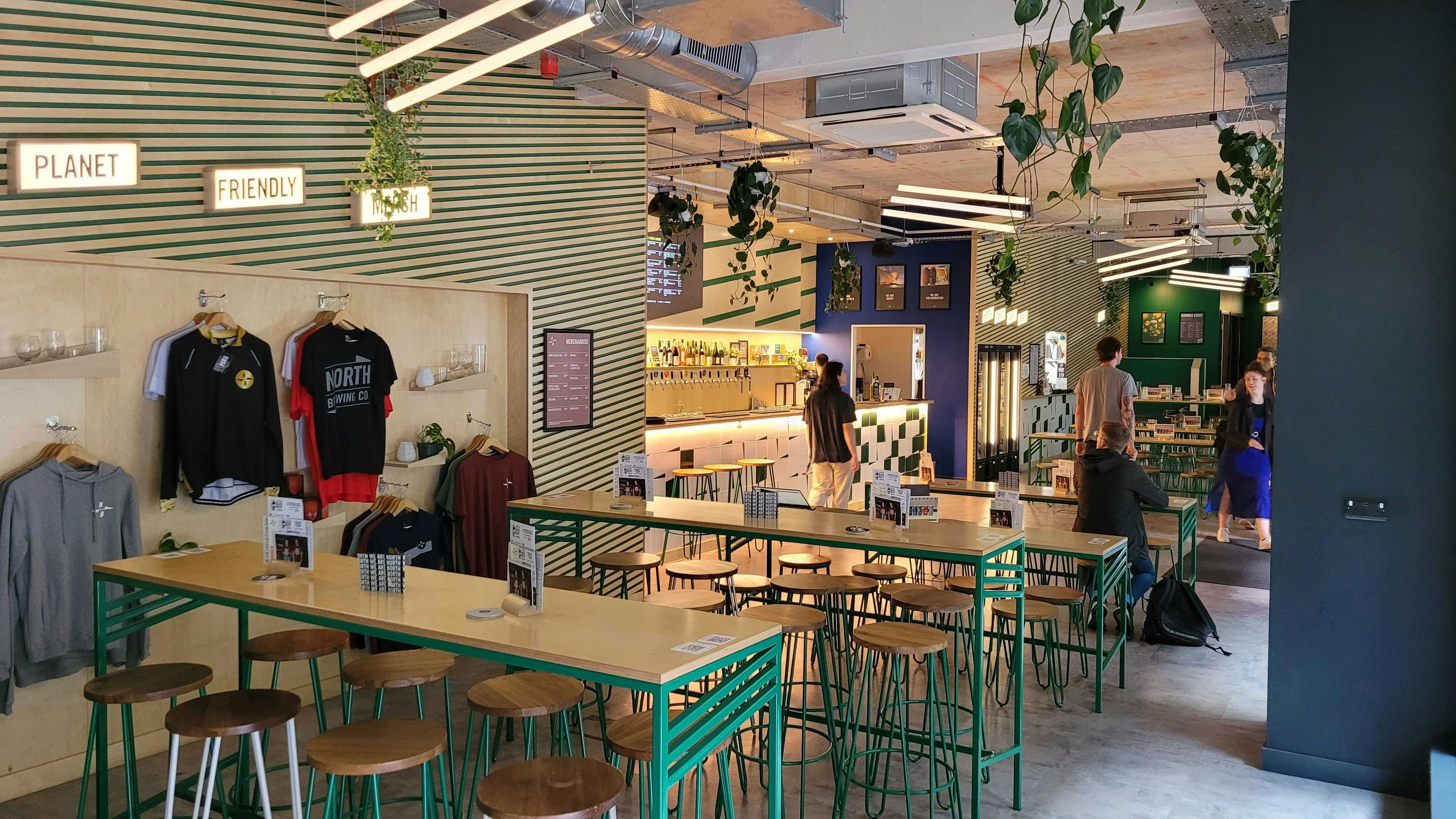 Vibrant modern event space with communal tables for casual gatherings and networking.