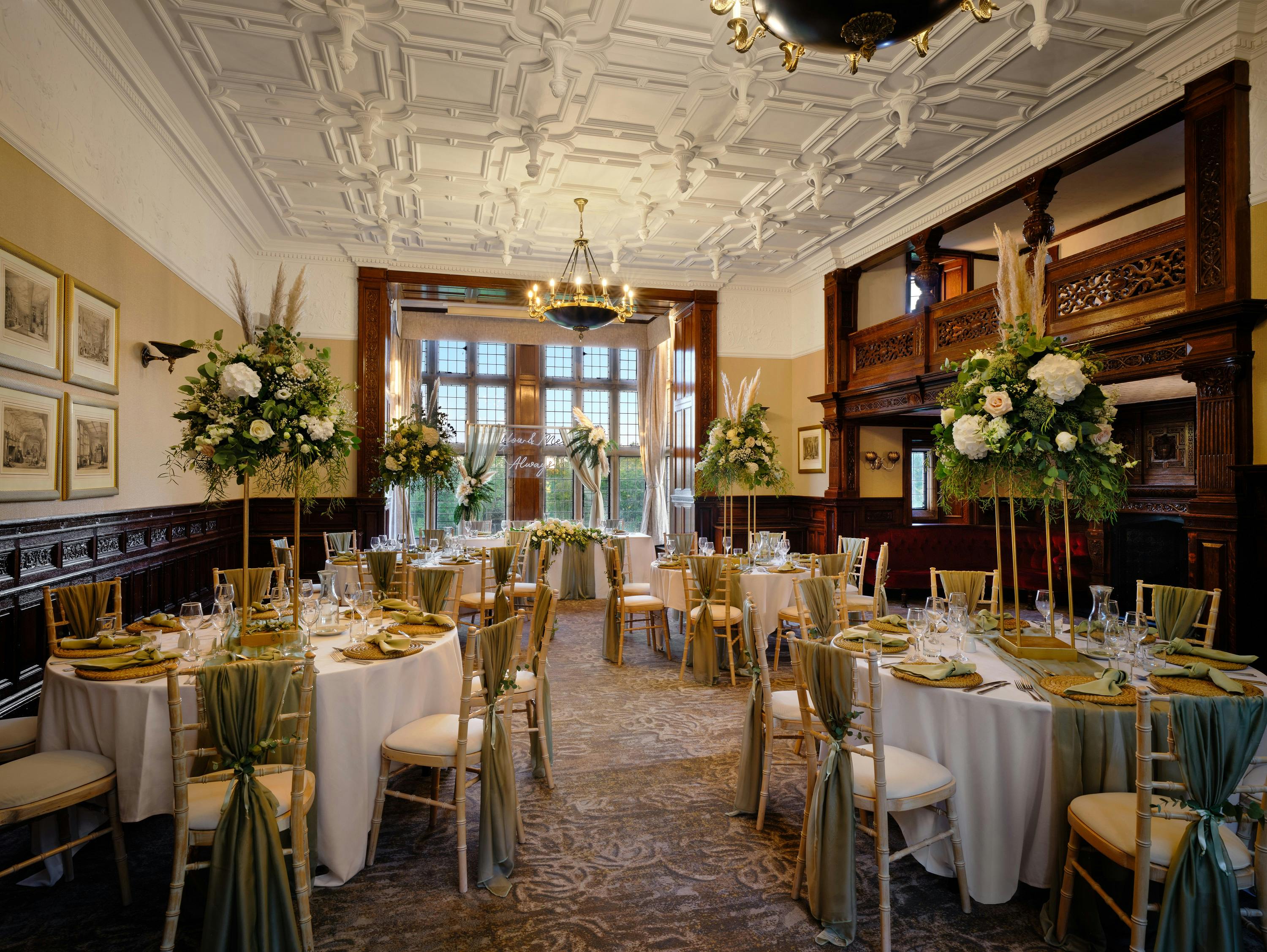 Elegant banquet room with floral centerpieces for weddings and corporate events.