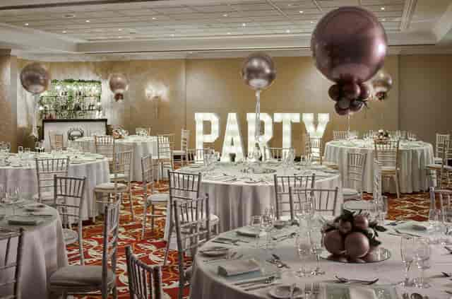 Elegant Worsley Suite event space with round tables, perfect for weddings and parties.